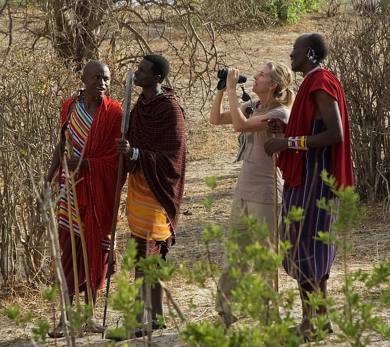 Monica Bond speaks with local Masai tribal members