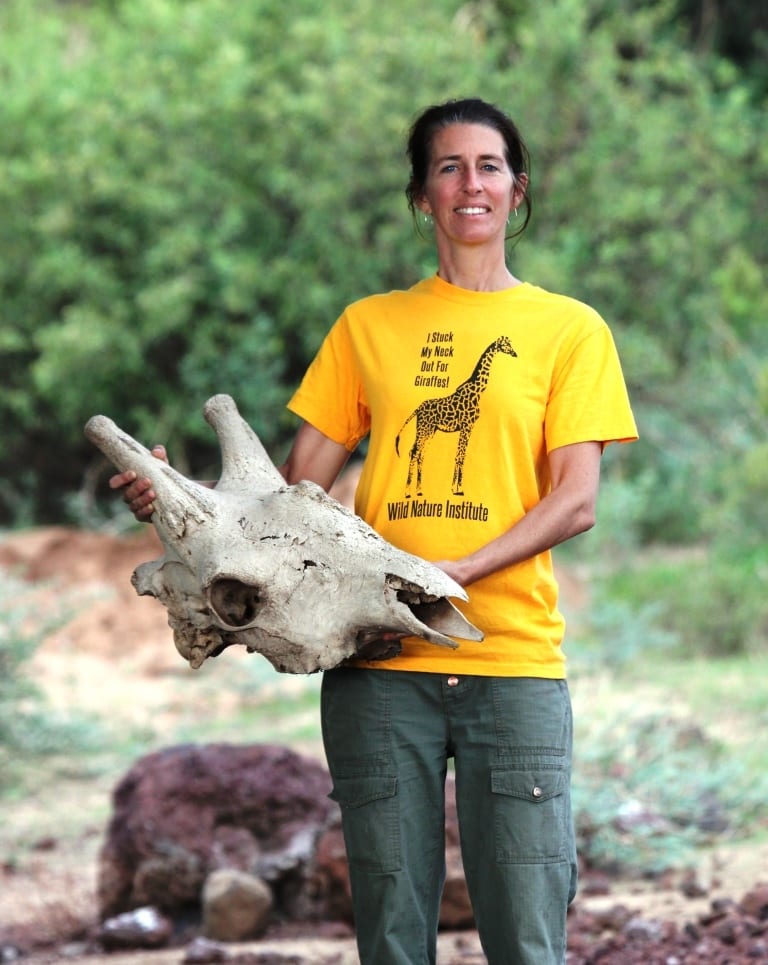 Monica Bond holds a giraffe skull